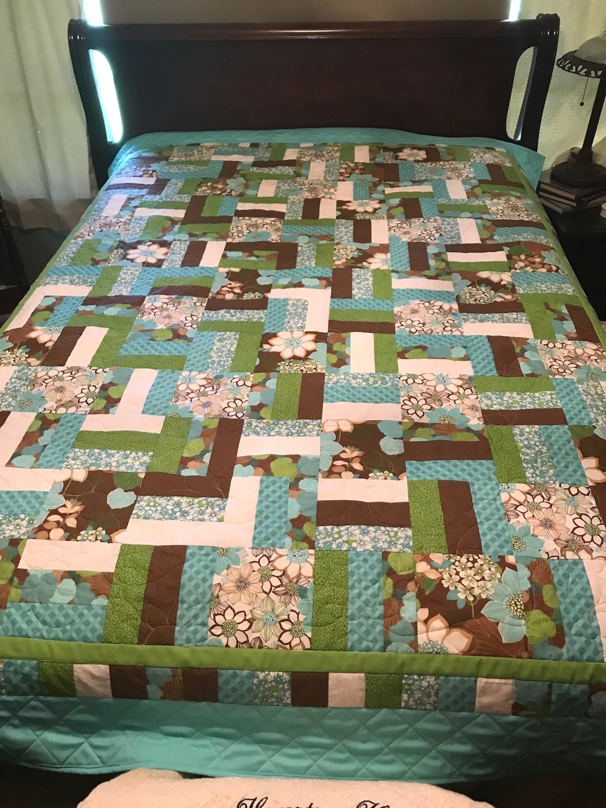 Wildflower quilt on a bed