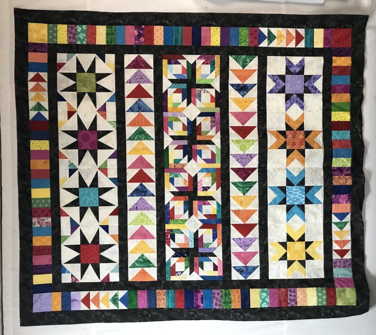 Curiosity quilted blanket